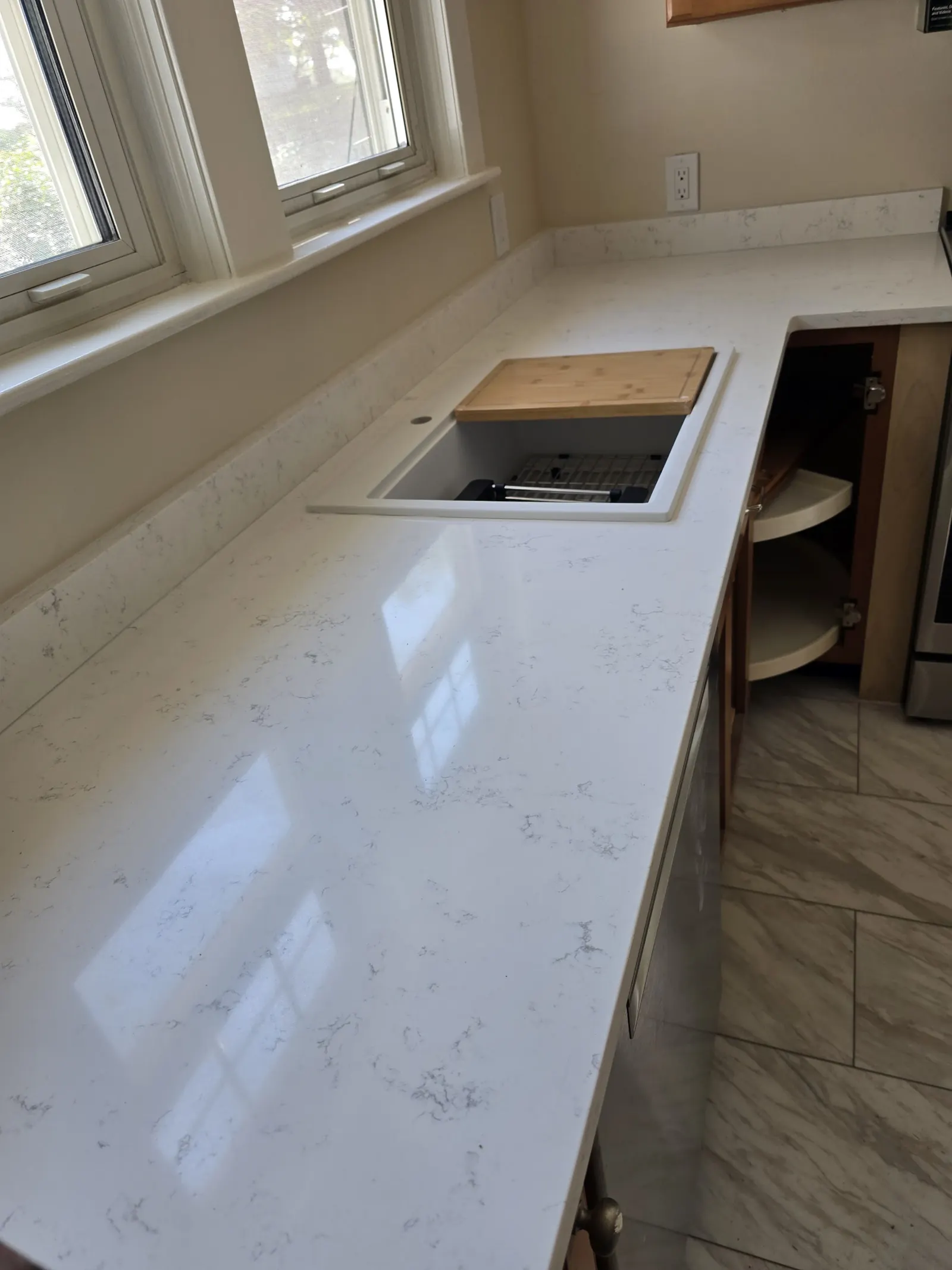 L-shaped white quartz countertop with undermount sink
