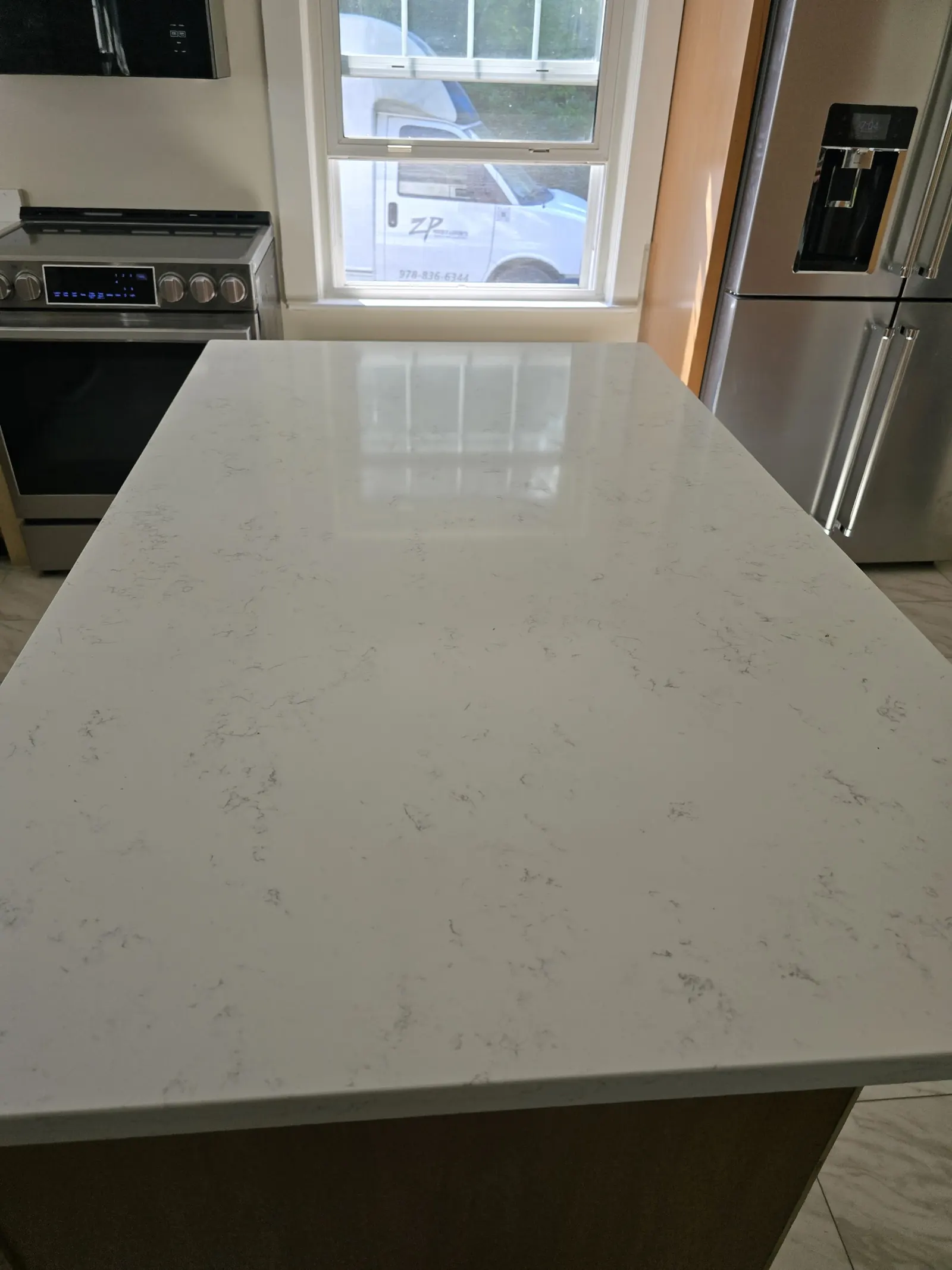 New white quartz countertop on a kitchen island